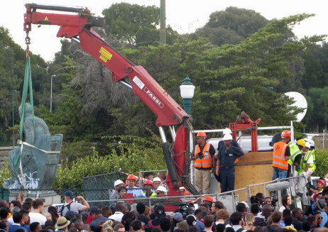 Statue of Cecil John Rhodes being removed from the University of Cape Town campus, April 2015. <br />
[Source: Wikimedia commons: https://commons.wikimedia.org/wiki/File:Goodbye_Cecil_John_Rhodes20_(16481463023).jpg ]