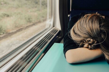 Image Sleeping woman in train at daytime by Abbie Bernet. Reproduced under Unsplash License